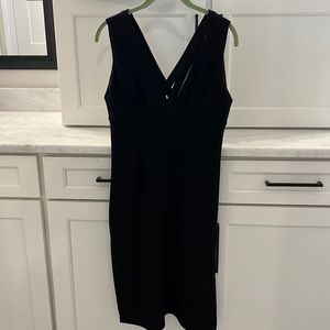 BCBGeneration LBD. Side slit on both sides, sleeveless, mid length